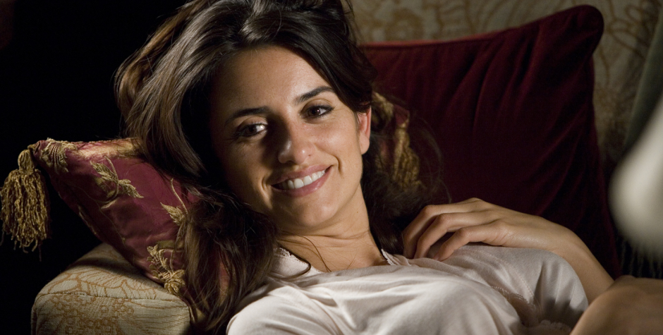 Penélope Cruz reclining on sofa smiling in Elegy movie still