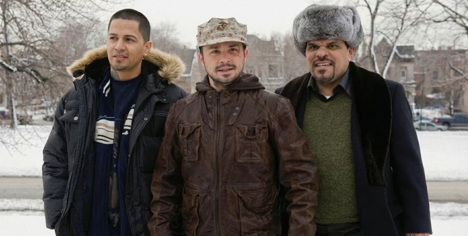 Jay Hernández, Freddy Rodriguez, Luis Guzmán stand outdoors in snow wearing winter coats