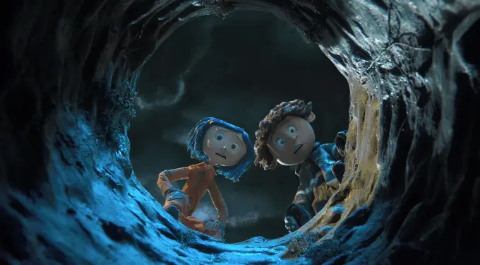 Coraline and Wybie look into a dark hole with concerned faces