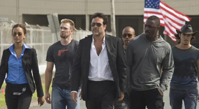 The main cast walks together in a scene from The Losers