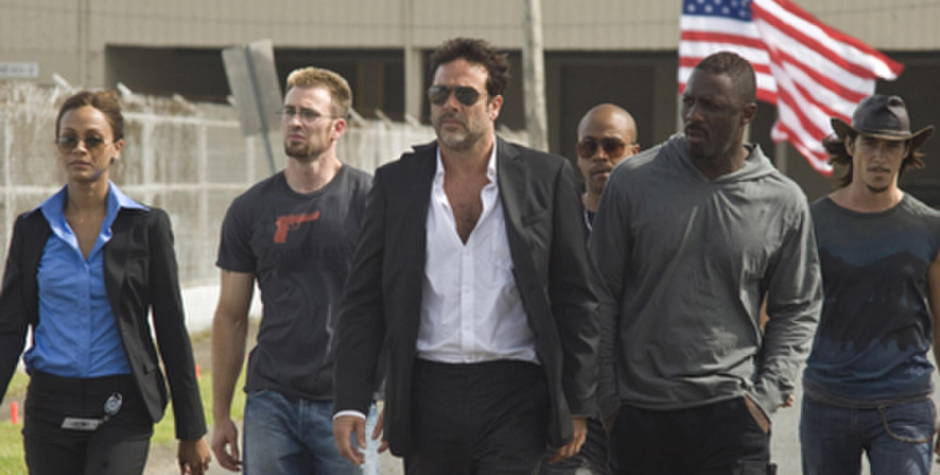 The main cast walks together in a scene from The Losers