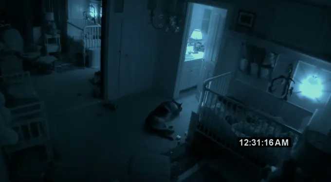 Paranormal Activity 2 nursery scene with crib and dog from official trailer