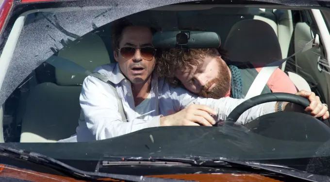 Robert Downey Jr. and Zach Galifianakis in car, one asleep on shoulder