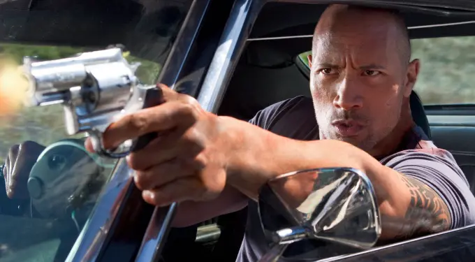 man with tattoo shoots a revolver from car window