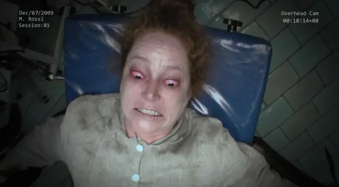 distressed woman with red eyes lies on medical chair, overhead cam