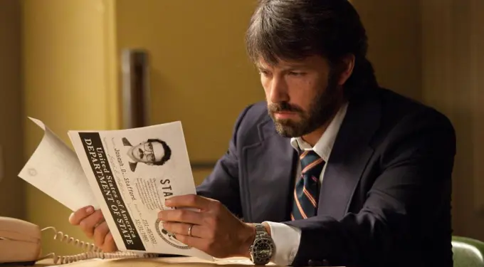 Ben Affleck reading a classified document as Tony Mendez in Argo