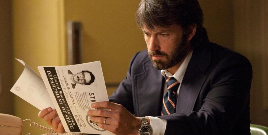 Ben Affleck reading a classified document as Tony Mendez in Argo