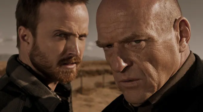 Close-up of two men with serious expressions outdoors