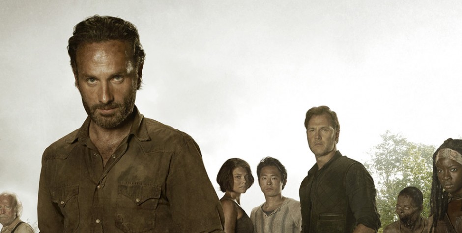 Andrew Lincoln with Walking Dead cast in forest, serious expressions