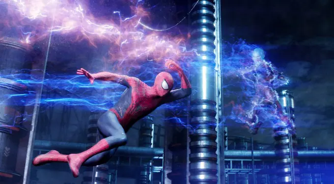 Spider-Man dodges electric blast from Electro in dark industrial area