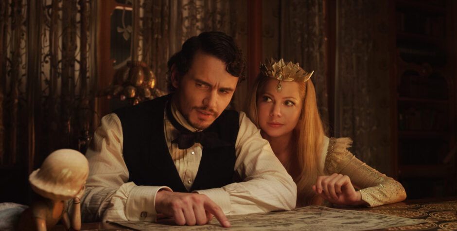 James Franco and Michelle Williams study a map in period costumes