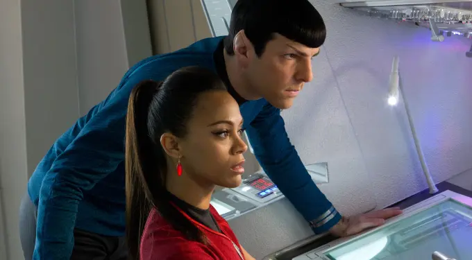Zoe Saldana and Zachary Quinto examine control panel intensely