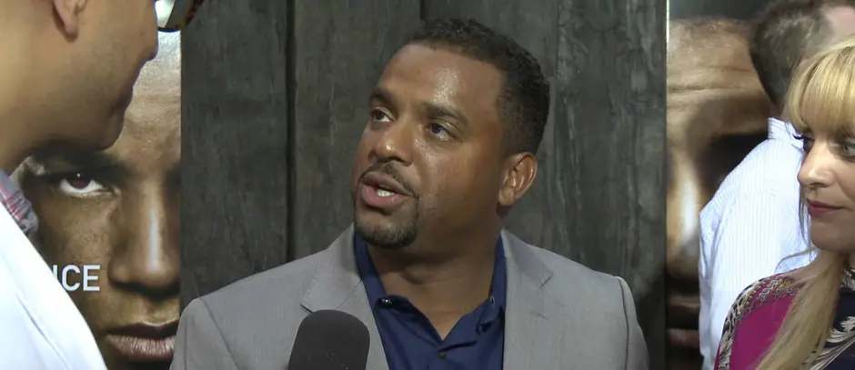 Alfonso Ribeiro giving an interview at an event, 2013
Alfonso Ribeiro in gray suit talking to a reporter at event