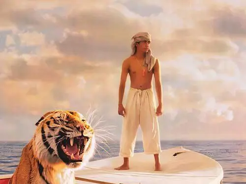Life of Pi movie poster showing boy with tiger on lifeboat