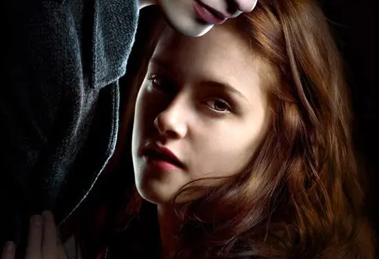 Edward Cullen leans over Bella Swan in Twilight movie poster