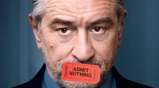 Robert De Niro with a red ticket labeled Admit Nothing over mouth