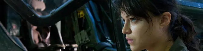 Side profile of woman inside vehicle cockpit looking forward