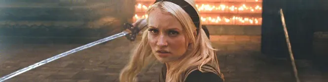 Blonde woman looking tense as sword is pointed at her