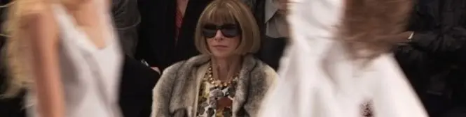 Anna Wintour wearing sunglasses at fashion runway show