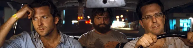 Three men in car driving at night in The Hangover scene