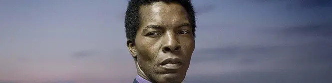 close-up of a man looking to the right with serious expression