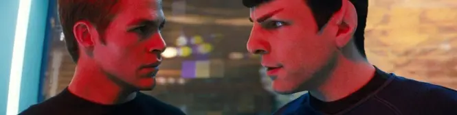 two men face each other closely under red lighting in tense scene