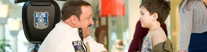 Paul Blart security guard smiles at young boy in mall
