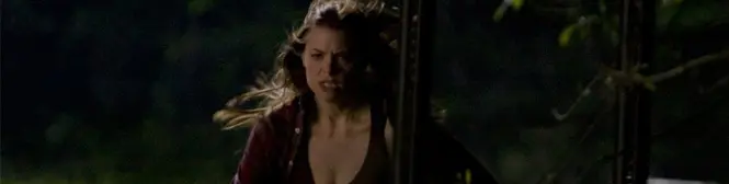 Woman running at night outdoors, distressed expression