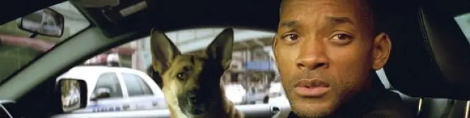 Will Smith and dog seated inside car looking outside