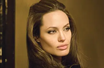 Angelina Jolie close-up headshot looking away from camera