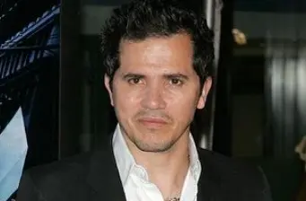 Headshot of Colombian-American actor John Leguizamo looking serious