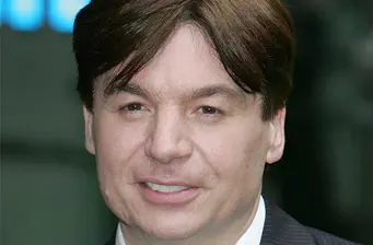 Close-up headshot of Mike Myers with brown hair and neutral expression
