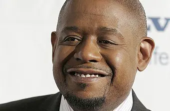 Forest Whitaker headshot with slight smile on neutral background