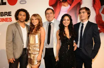 Four actors posing together at a formal event