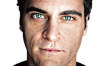 Close-up headshot of actor Joaquin Phoenix looking directly at camera