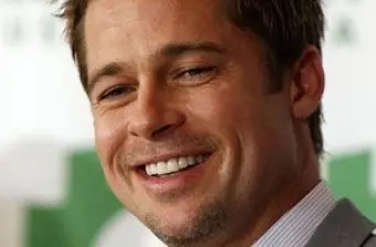 Close-up smiling headshot of Brad Pitt