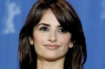 Penelope Cruz close-up headshot with neutral expression and dark hair