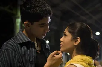 Young man and woman in close conversation at night
