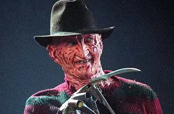Close-up of Freddy Krueger in signature hat and glove with blades