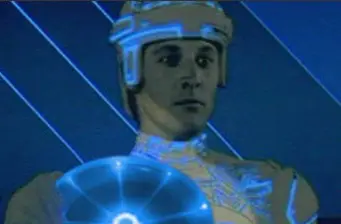 Man in glowing helmet and suit from Tron movie scene
