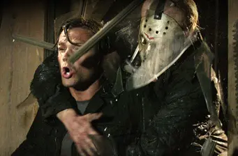 Jason Voorhees grabs man with weapon ready to strike