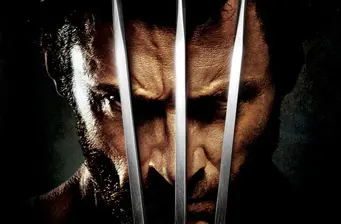 Close-up of Wolverine with metal claws extended in front of his face