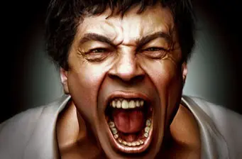 Close-up headshot of Benicio del Toro shouting with mouth wide open