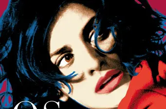 Close-up of woman with dark hair and red lips from movie poster