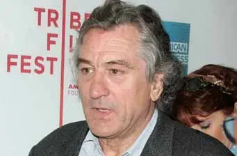 Robert De Niro in front of Tribeca Film Festival backdrop