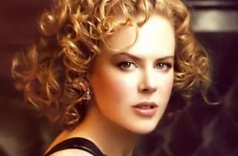 Nicole Kidman close-up headshot with curly hair and neutral expression