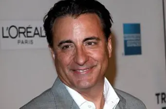 Headshot of Cuban-American actor Andy Garcia smiling at an event