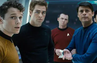 Four men in Starfleet uniforms in a tense Star Trek movie scene