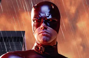 Close-up of Daredevil in red mask with stormy sky behind