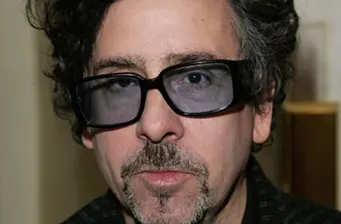 Close-up of director Tim Burton wearing black glasses